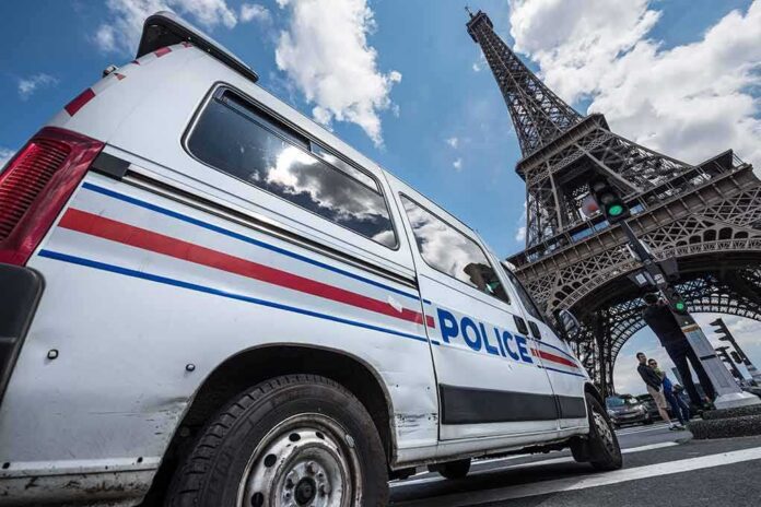 shutterstock_444207802 Police van near the Eiffel Tower