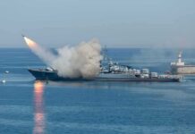 Navy’s $25K Bet Upends Air Defense Warship launching a missile at sea