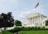 Veterans Rebel: Arlington Arch Showdown The U.S. Supreme Court building with an American flag and landscaped grounds