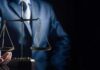 Mississippi Judge Targeted – Coast-To-Coast Menace Scales of justice held by a person in a suit