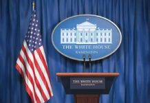 Ambassador Turmoil: Donor Fight Erupts White House press briefing podium and US flag