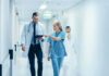 Pope’s Hospital Exit Sparks Big Questions Doctor and nurse walking in a hospital corridor reviewing a tablet