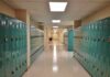 School hallway with rows of teal lockers