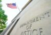 Department of Justice building with American flag