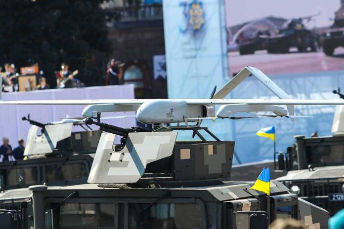 shutterstock_2034373115 Military drone mounted on armored vehicle
