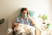 Backlash Explodes Over Surrogacy ‘Breastfeed’ Joke Mother nursing baby while drinking from a mug in a cozy chair
