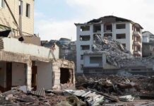 Anonymous Diary Exposes ISIS Reign Collapsed apartment buildings amid heavy rubble