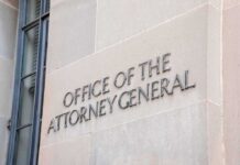 Office of the Attorney General building sign on stone wall
