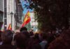Elder Eviction Sparks Spain’s Fury Crowd with Spanish flags in a city street