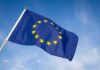 Shocking Court Ruling Triggers EU Backlash European Union flag waving against blue sky
