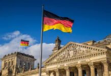 Robot Assault Probe Shocks Germany German flag flying above the Reichstag building