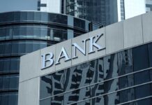 Treasury Watchdog Flags Ideology-Driven Denials Bank building facade with large sign and glass windows